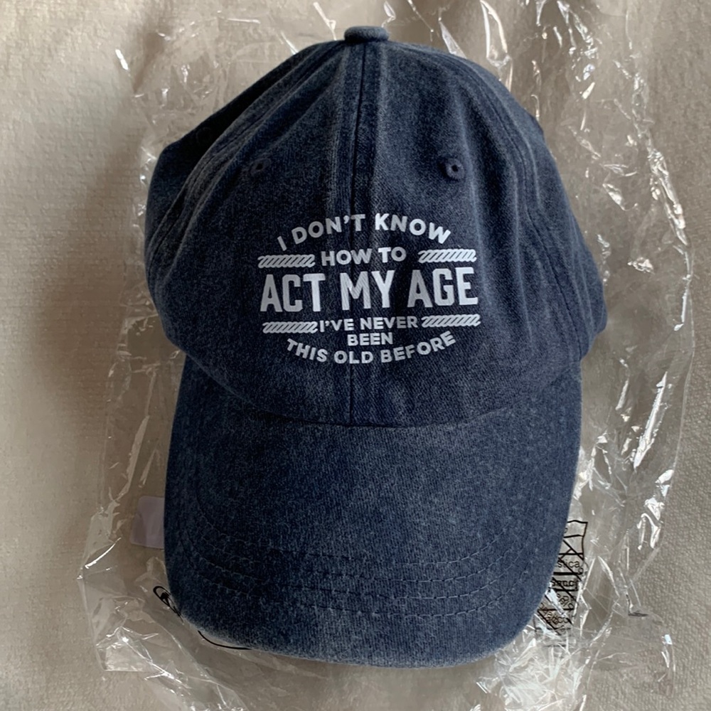 Brand new hat. “I don’t know how to act my age…. Denim blue. Adjustable.